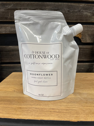 House of Cottonwood refill pouch on a wooden surface