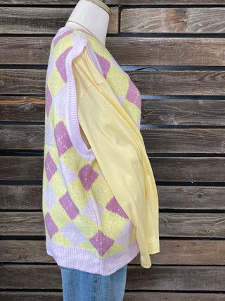Side view of sweater vest with yellow and purple pattern 