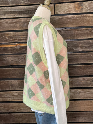 side view of green and pink argyle sweater vest