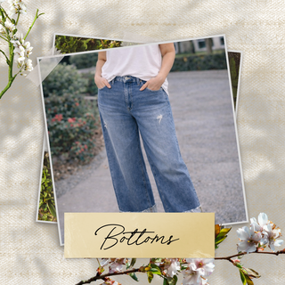 Person wearing blue jeans with a decorative 'Bottoms' label on a floral-themed background